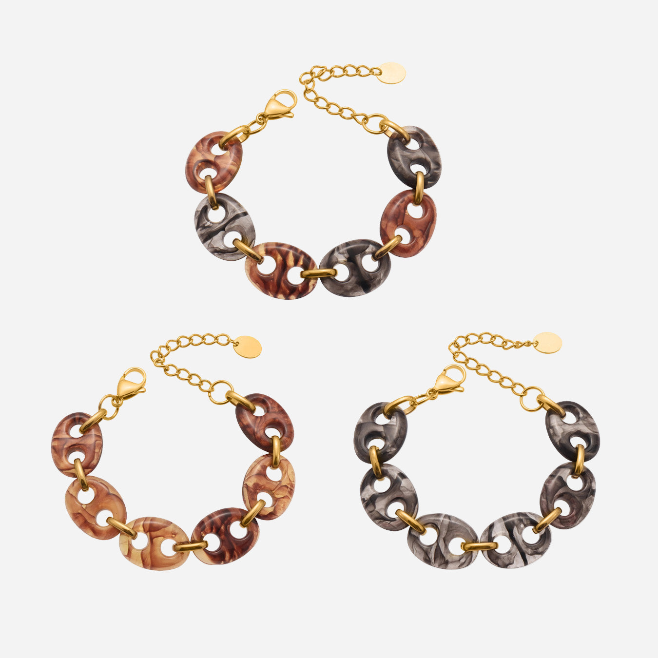 Three chain necklaces with different color combinations on a white background