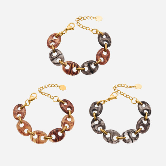 Three chain necklaces with different color combinations on a white background