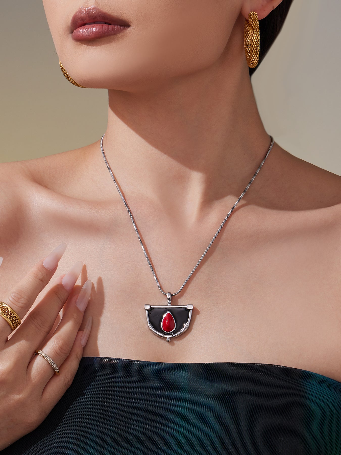 Gold Necklace with Black and Red Pendant