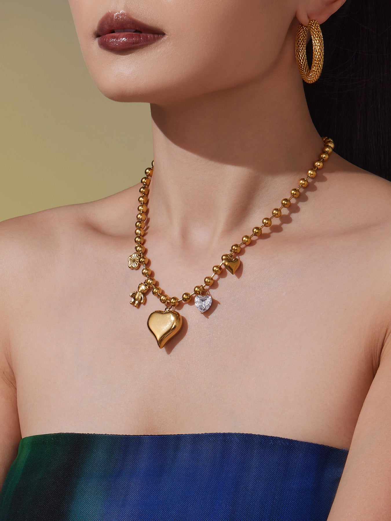 Gold Necklace with Heart and Other Charms
