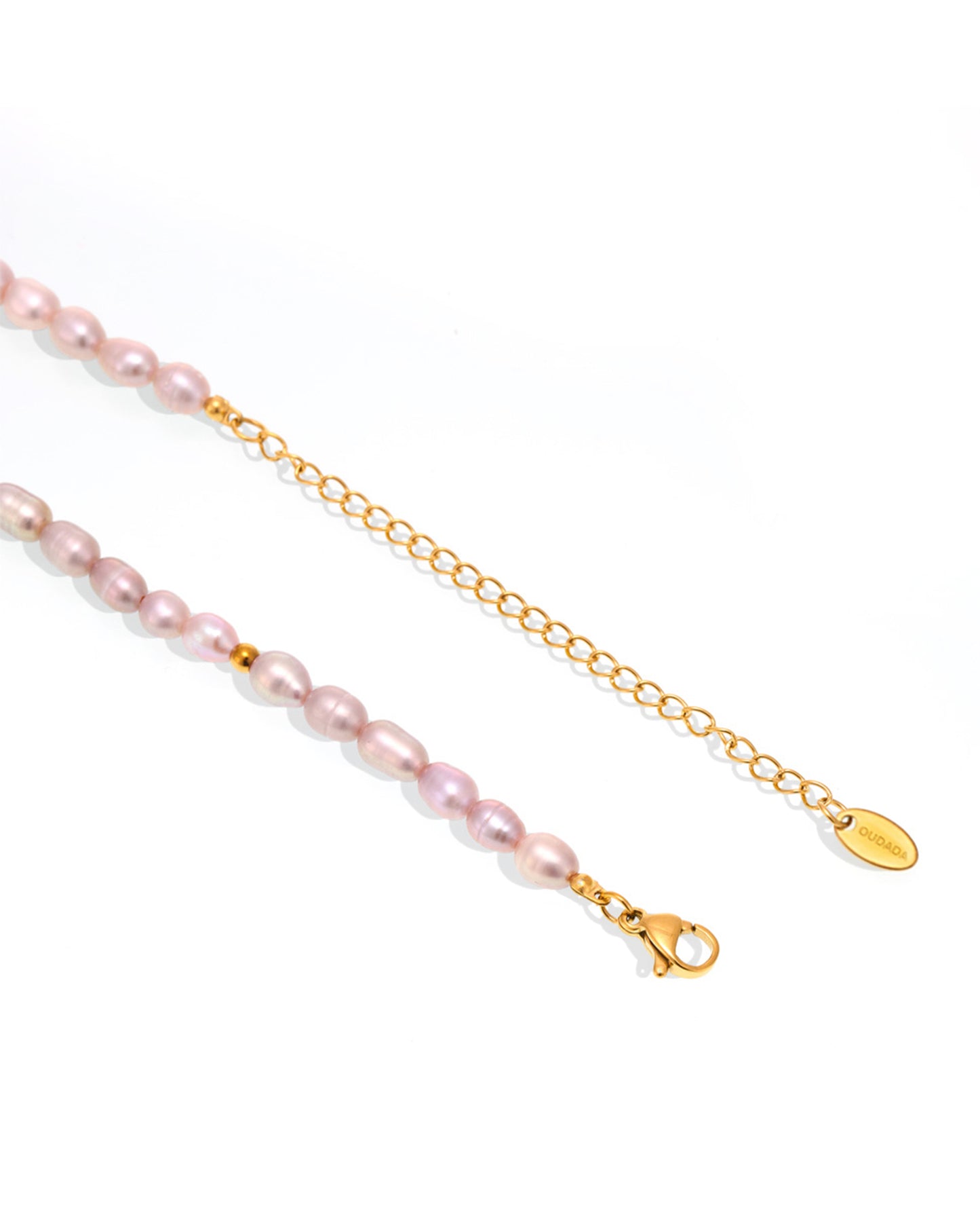 Close-up of natural freshwater pearls and gold-tone chain details