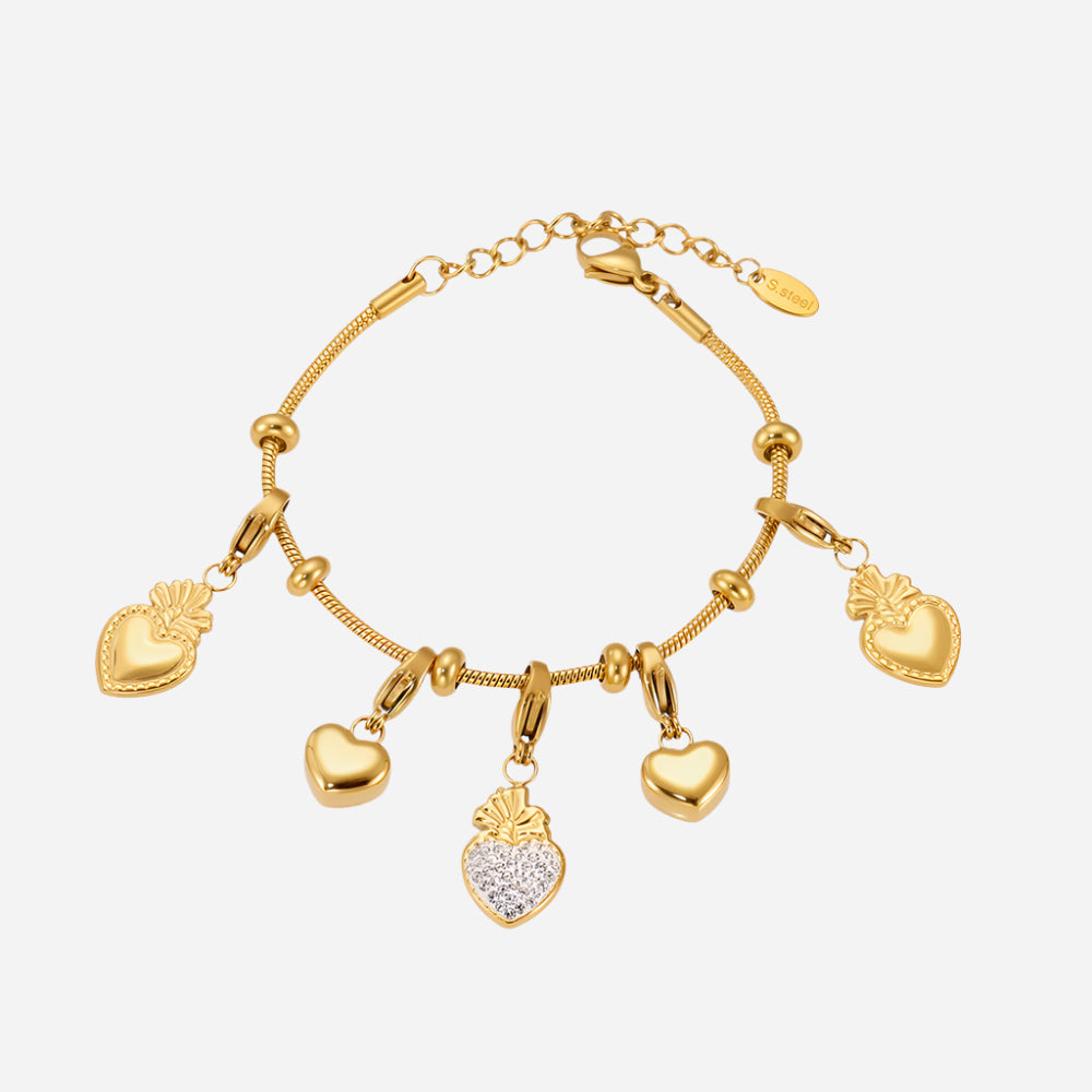 Gold interchangeable charm bracelet kit with heart-shaped charms on a white background, made from waterproof stainless steel.