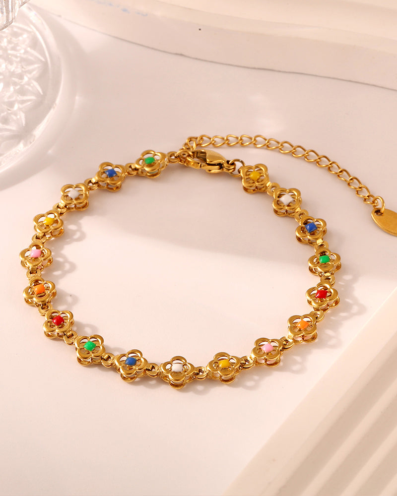 Close-up of mini floral bracelet links and clasp in gold finish