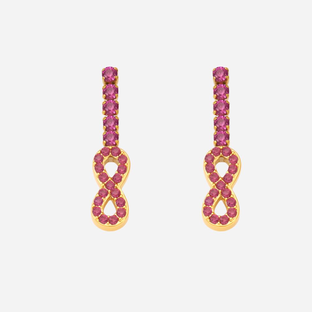 Gold earrings with pink gemstones on a white background
