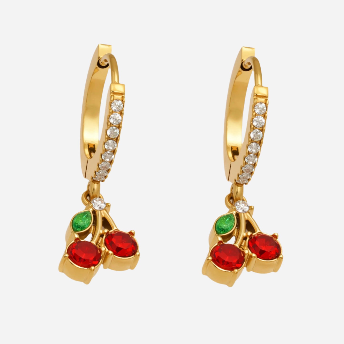Gold hoop earrings with red and green gemstones on a white background