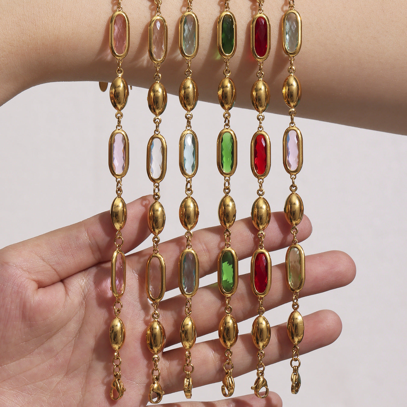 Model Wearing Czech Glass Stone Bracelets in Pink, White, Red, Green, and Multicolor