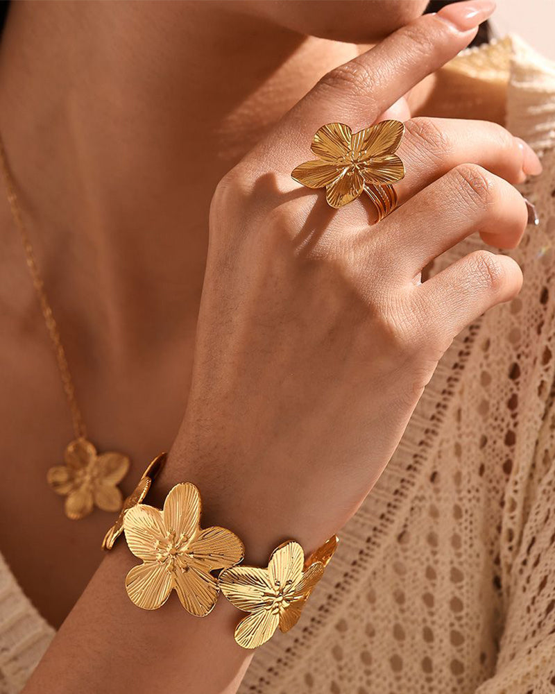 Woman wearing the Gold Flora Cuff Tennis Bracelet with a minimalist outfit