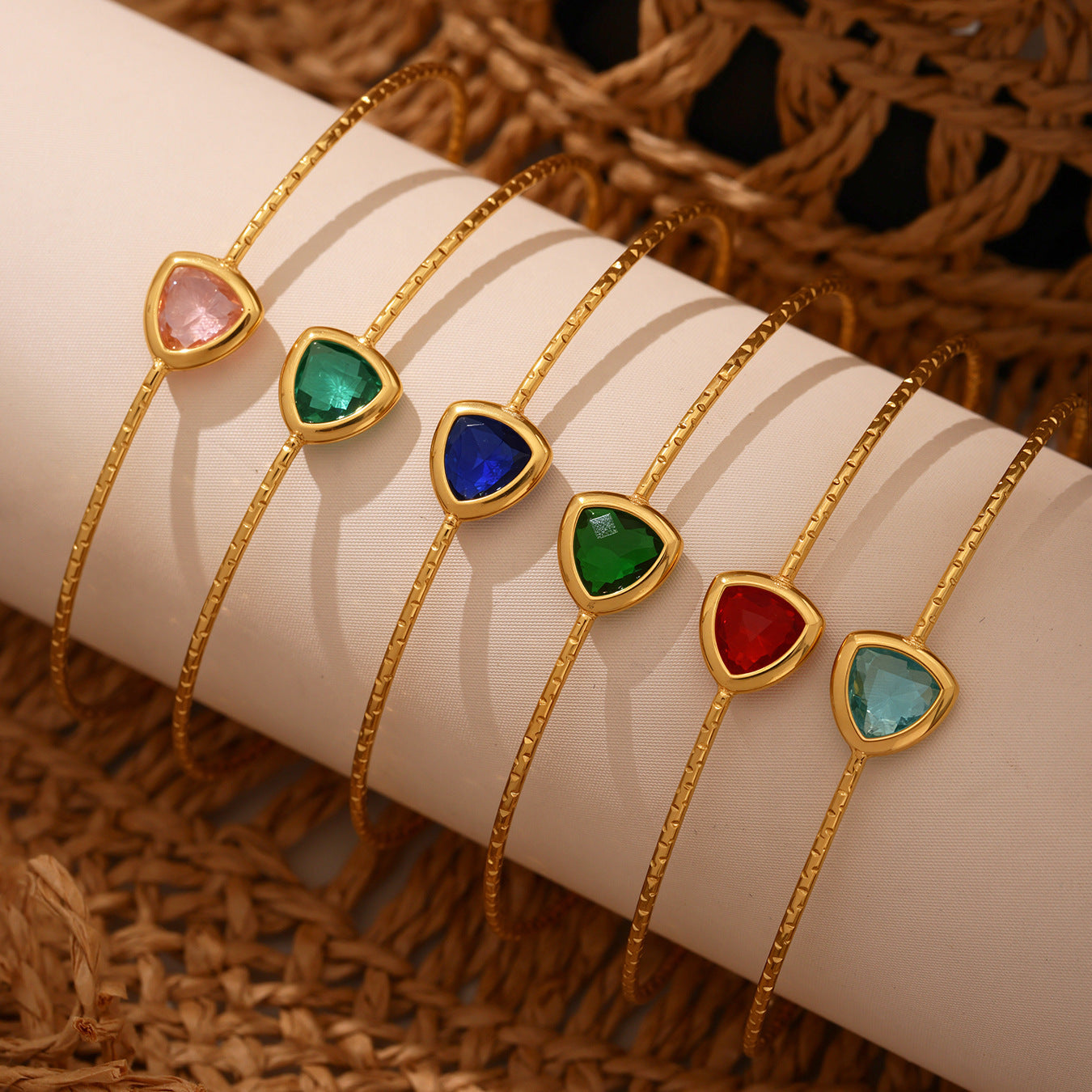 Various gold Czech glass bracelets styled in a casual lifestyle setting