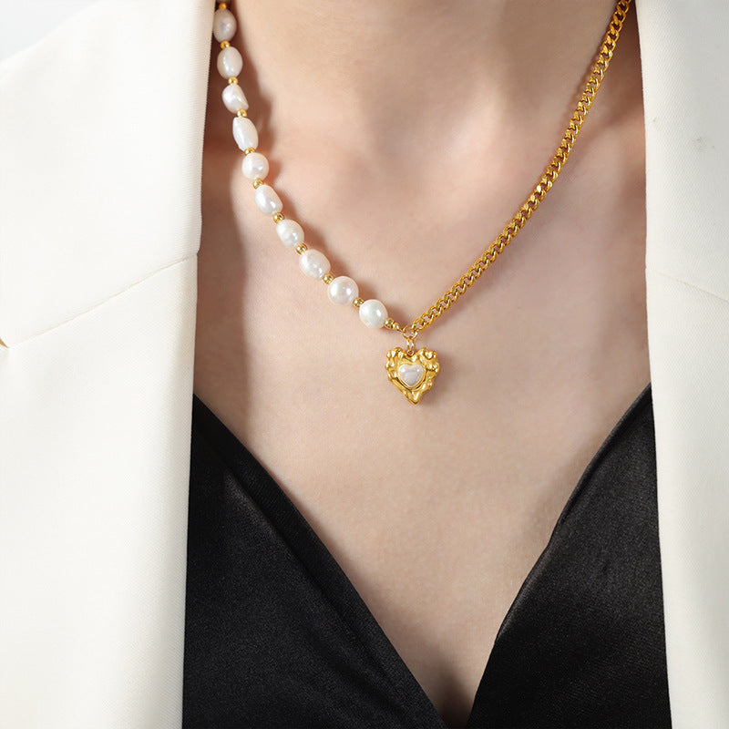 Model Wearing Luxe Radiance Gold Heart Pendant Necklace with Glossy Pearl Accent