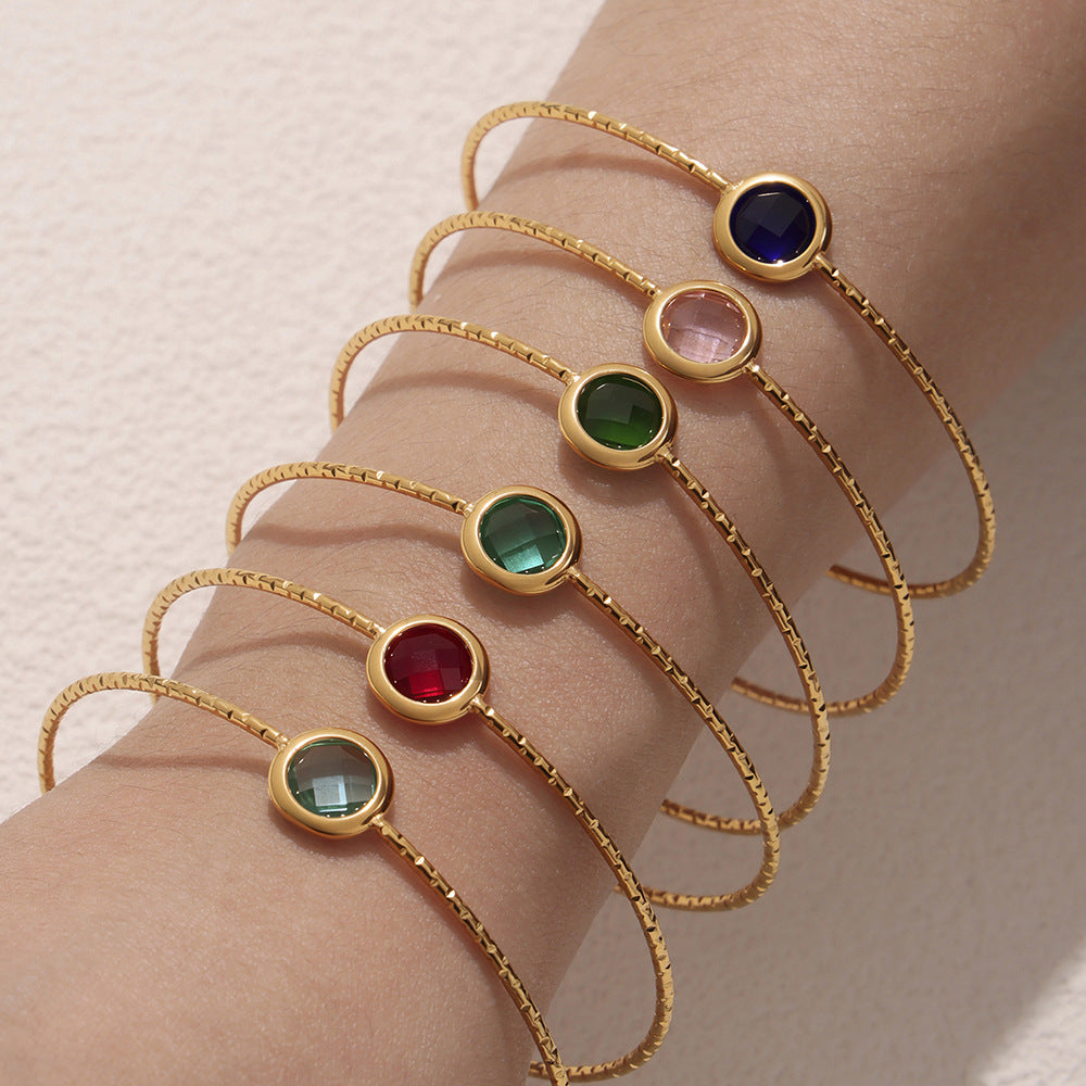 Woman wearing waterproof stainless steel round cut sea glass bracelet