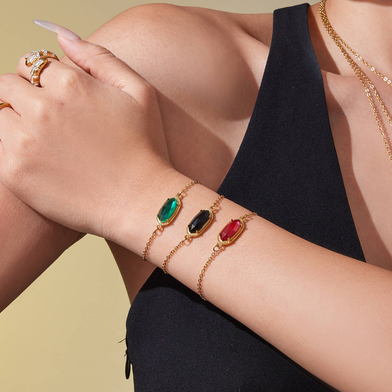 Model wearing ocean-inspired gemstone bracelet