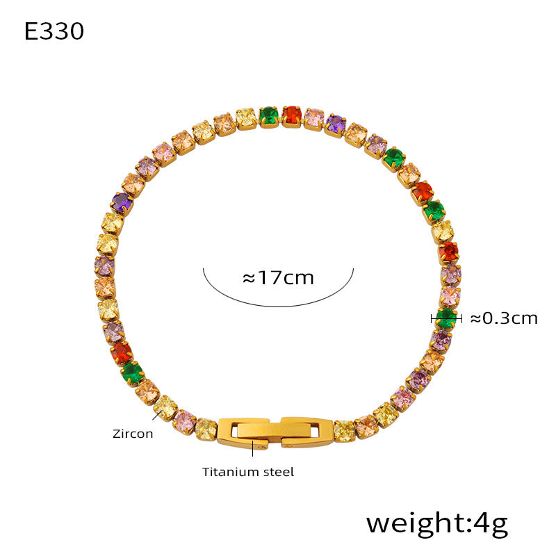 Multicolor zircon tennis bracelet with gold-tone clasp on white background – stainless steel jewelry