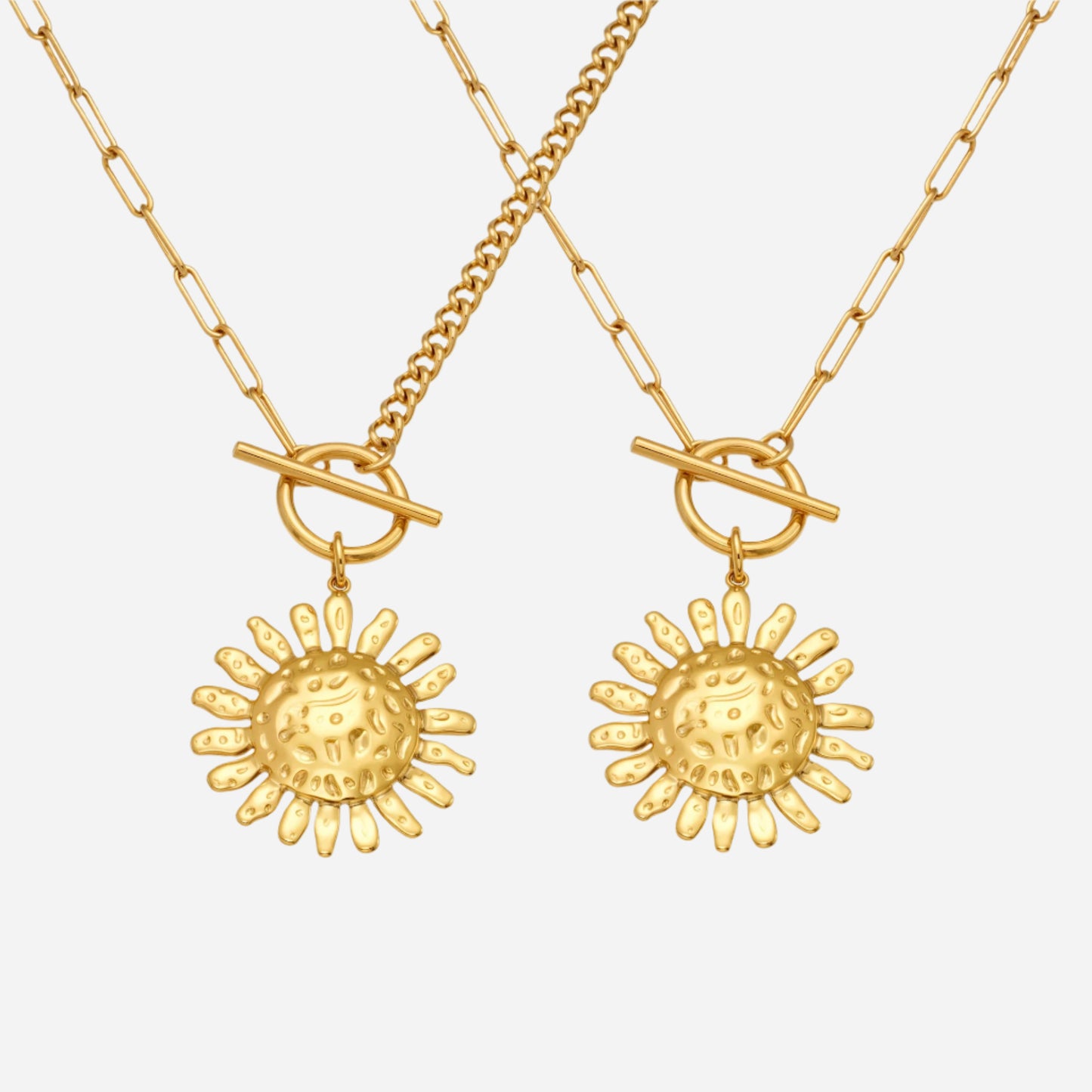 Two gold necklaces with sun-shaped pendants on a white background