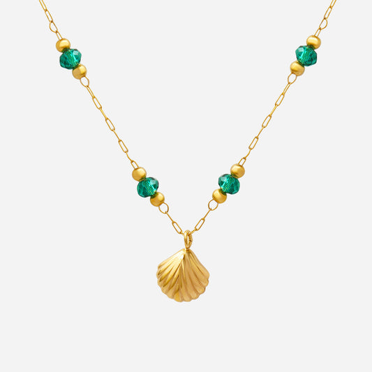 Gold necklace with green and gold beads on a white background