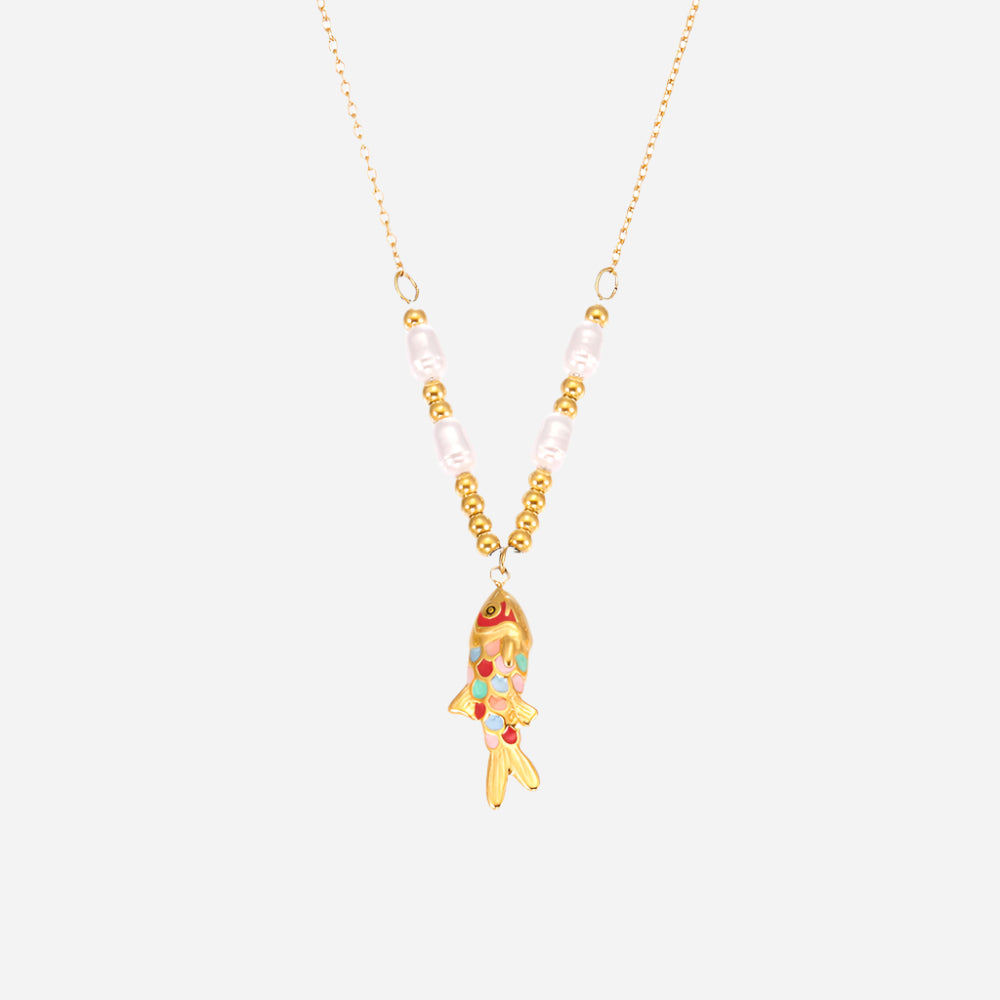 Necklace with a goldfish pendant and pearl beads on a white background