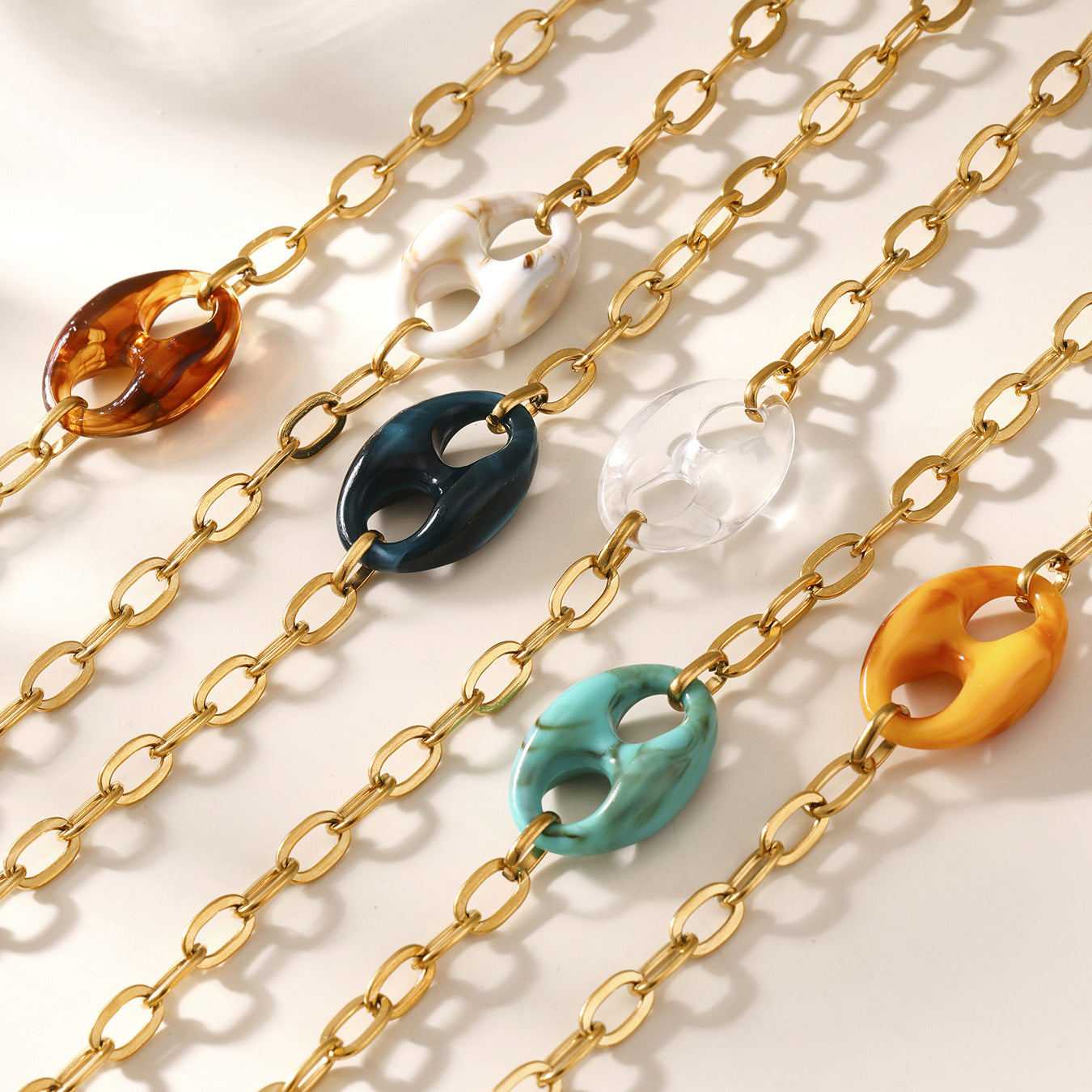 Close-up of waterproof stainless steel clasp and pig nose resin links
