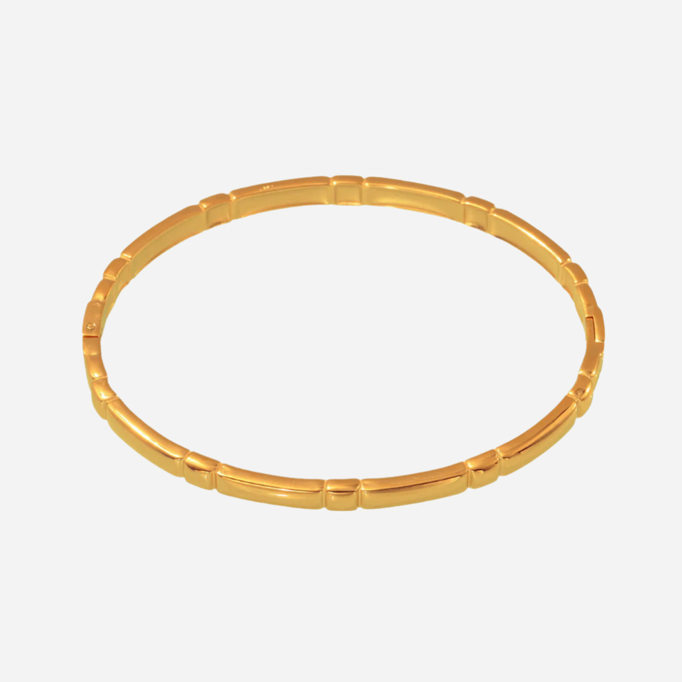 A gold tone cuff bracelet with a minimalist design, crafted from stainless steel with an 18K gold tone plating.