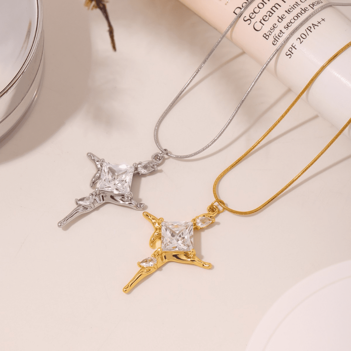 Styled scene with both Gold and Steel P2037 Pendant Necklaces – Side-by-side lifestyle shot