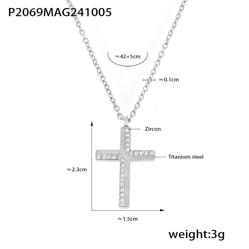 Silver cross pendant necklace with measurements and material details on a white background