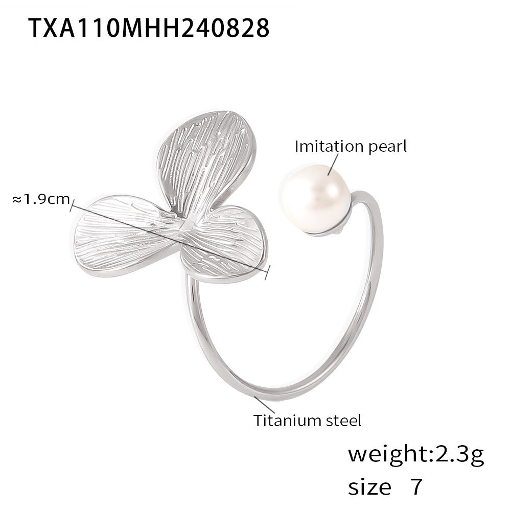 Silver bracelet with imitation pearl on a white background