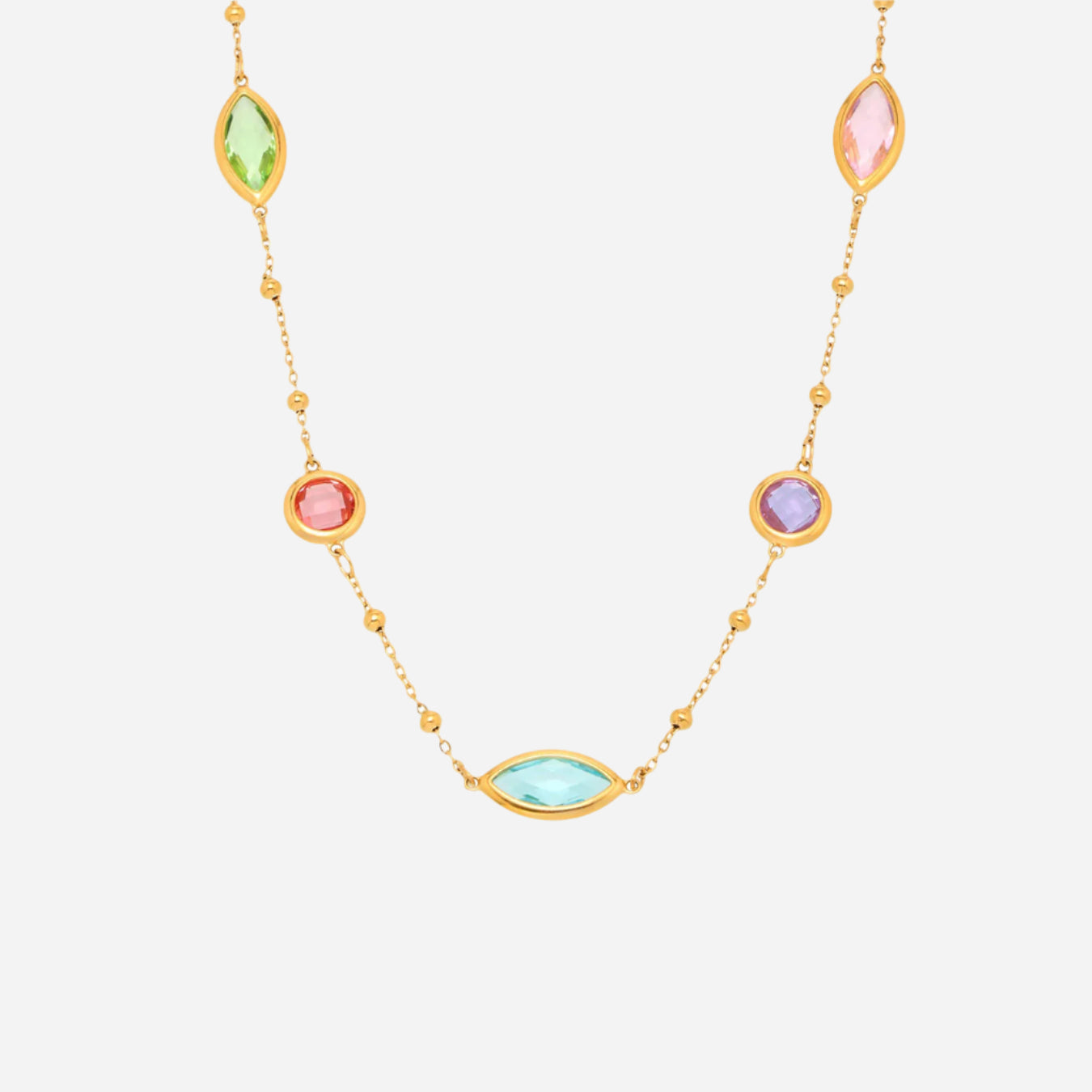Colorful sea glass necklace with gold beaded chain on white background