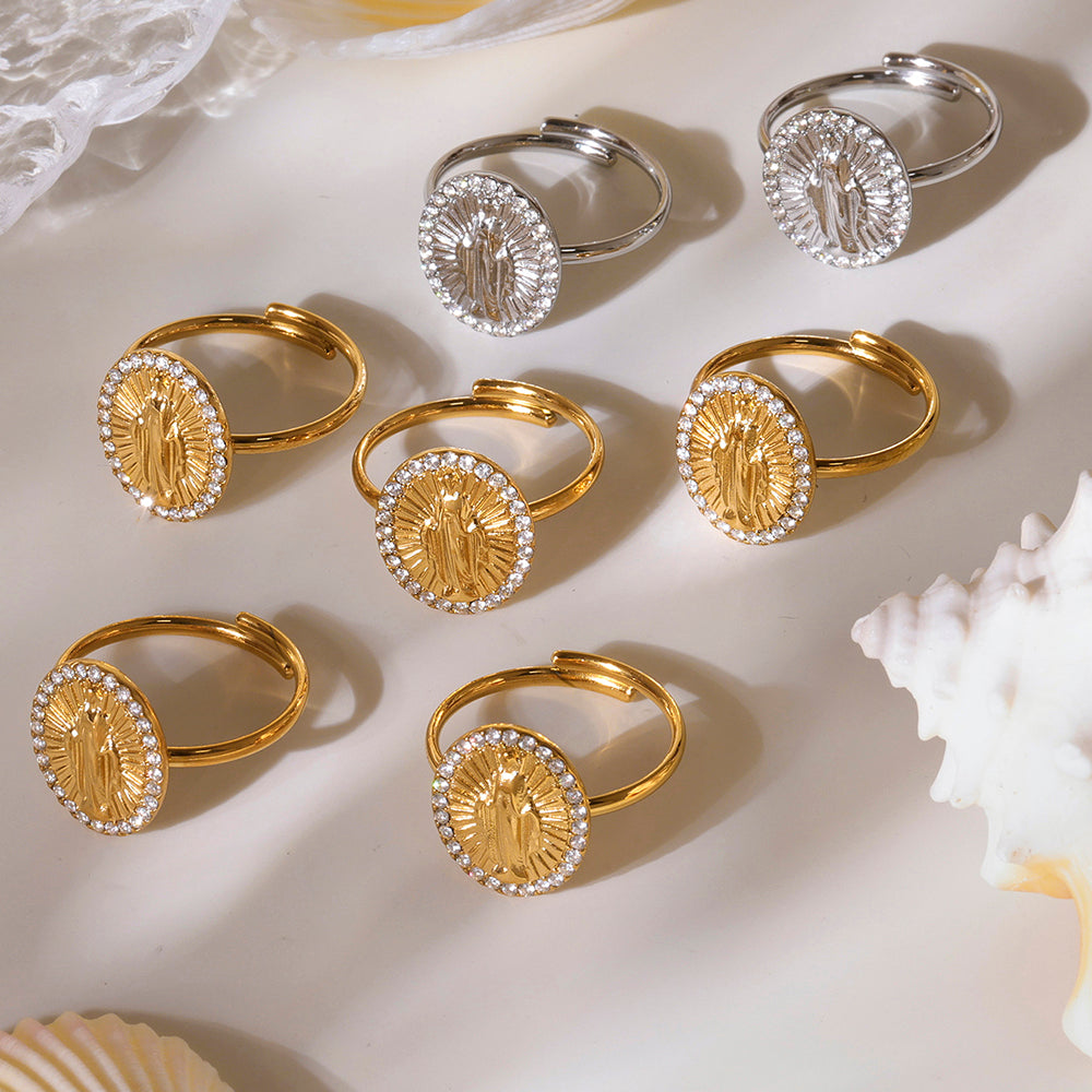 Gold and silver rings with circular designs on a light background
