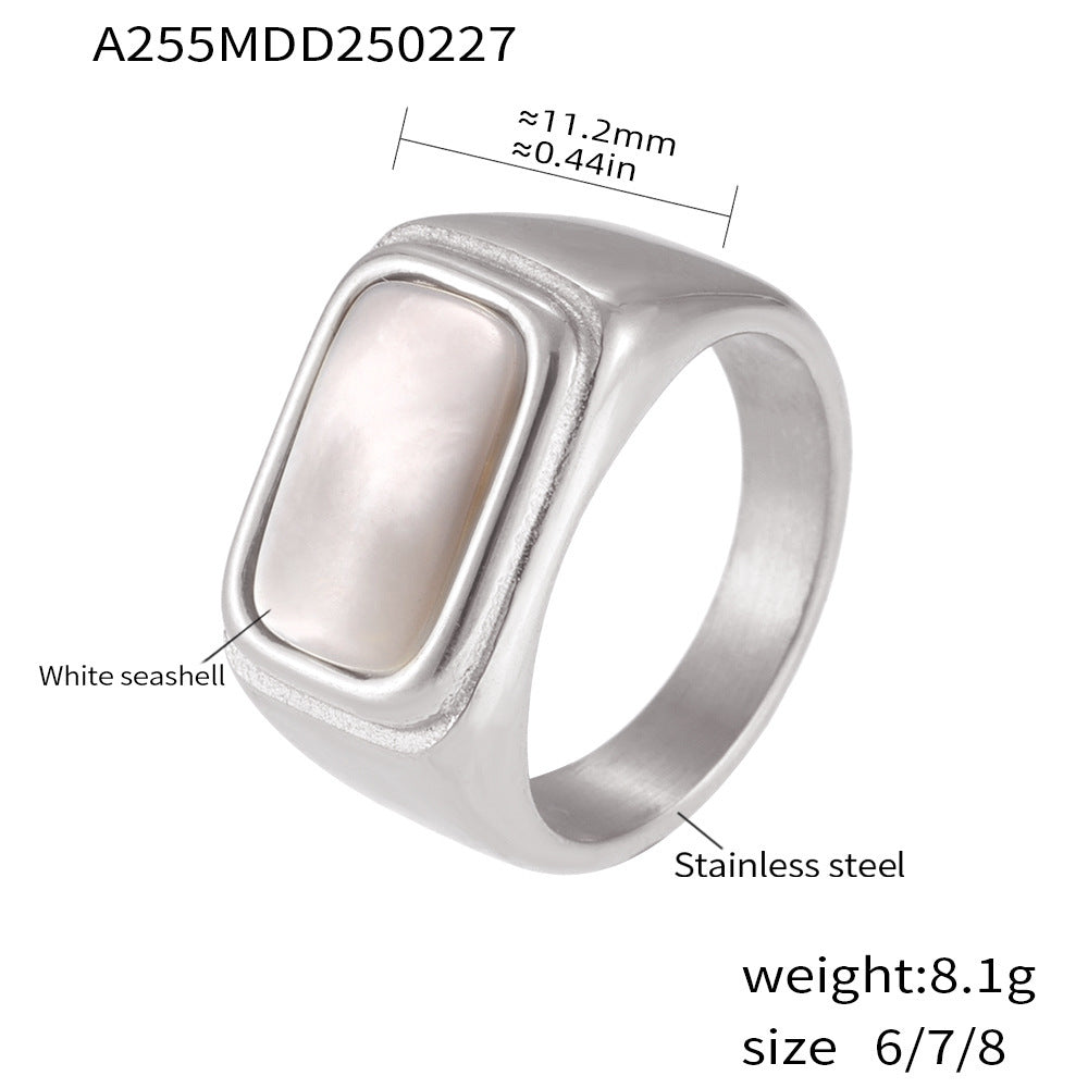 Silver stainless steel ring featuring inlaid white seashell and size chart