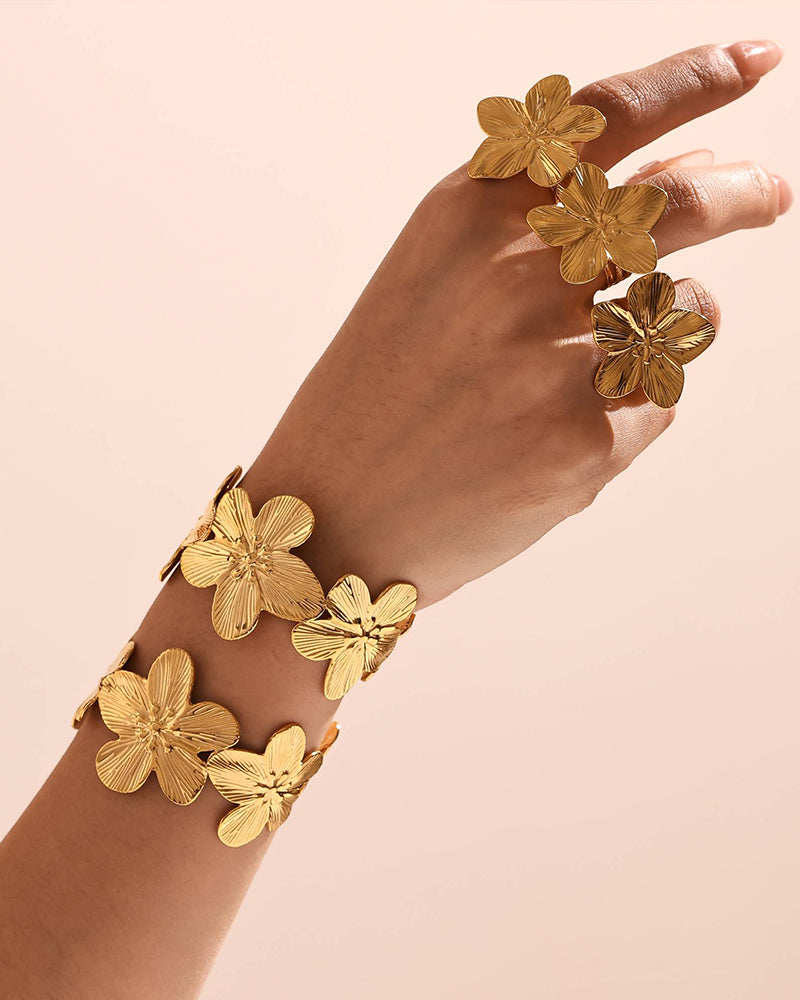 Model wearing the Gold Flora Cuff Bracelet under natural sunlight