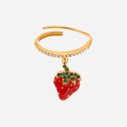 Gold bracelet with a red strawberry charm on a white background