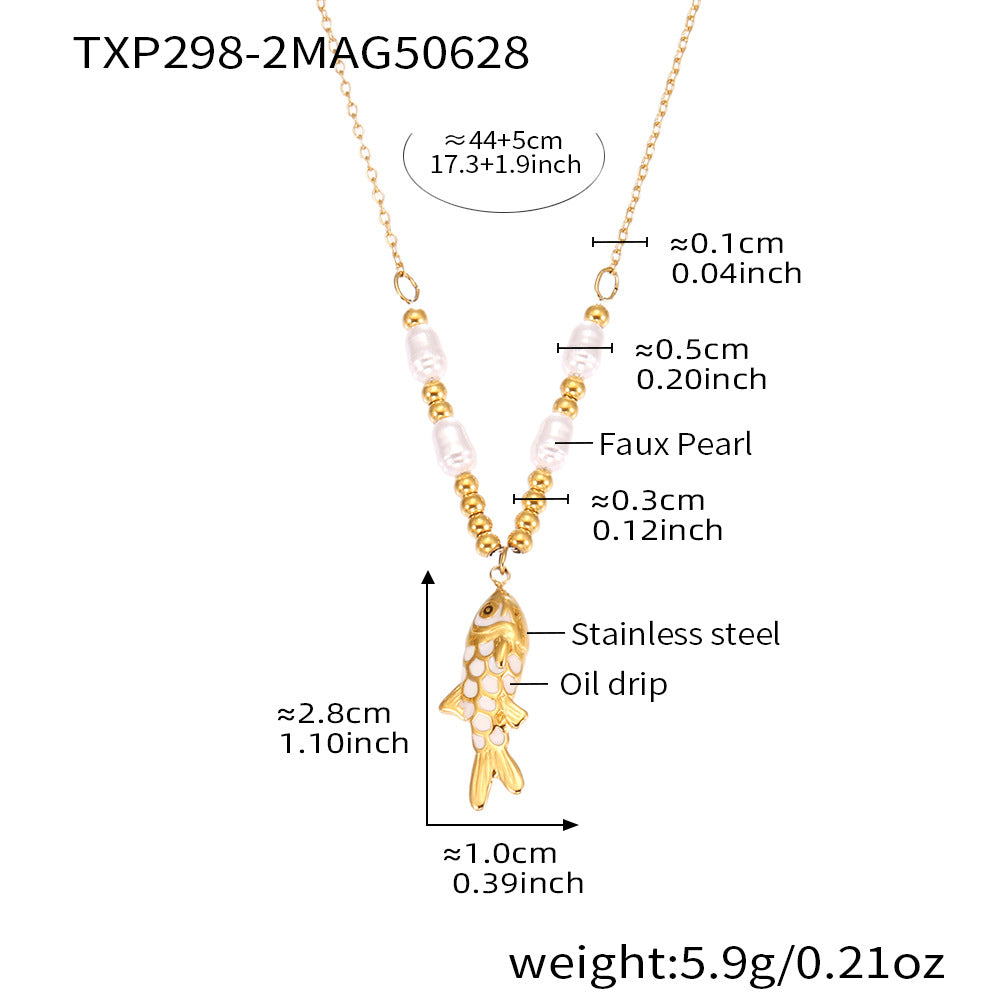 Gold fish pendant necklace with measurements on a white background
