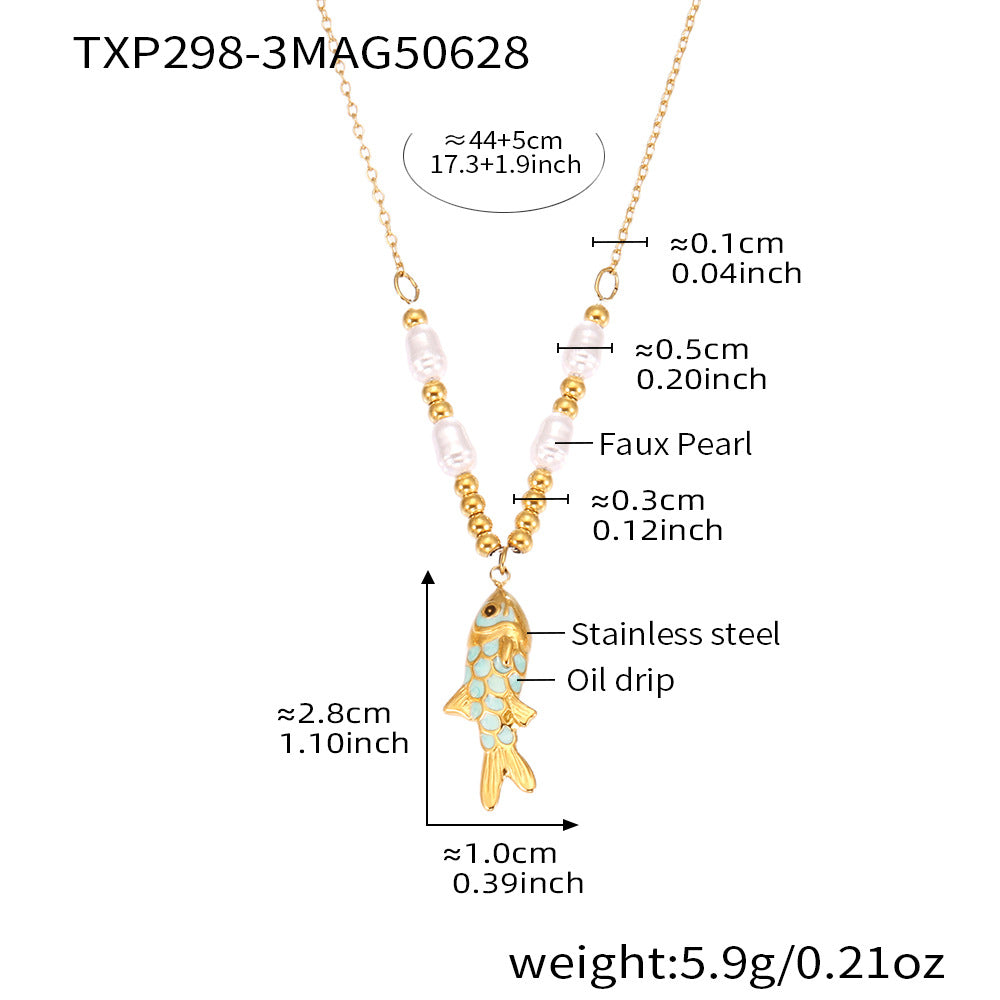 Gold necklace with fish pendant and measurements on a white background