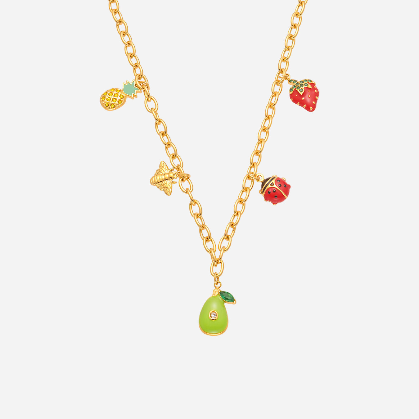 Gold necklace with fruit-themed charms on a white background