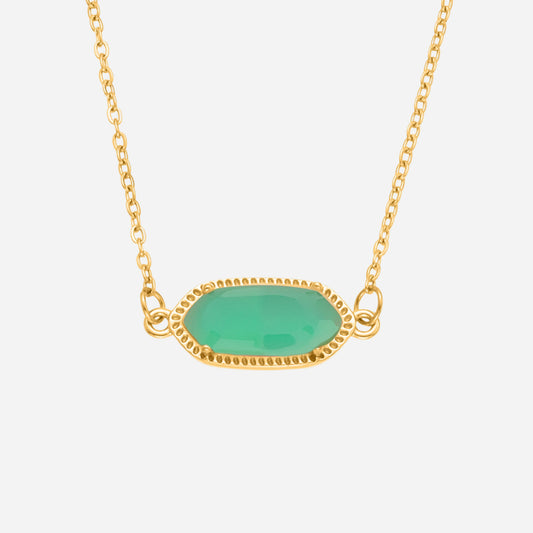 Gold necklace with a green pendant on a white background