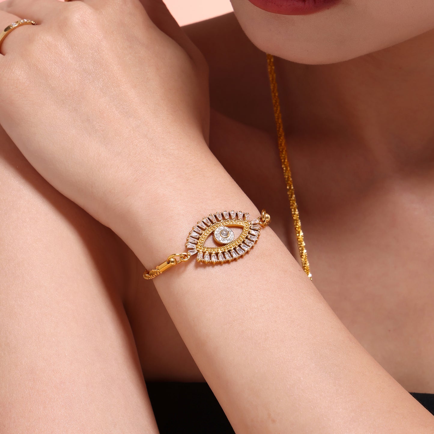 Model pairing Mystic Evil Eye Zircon Bracelet with layered stainless steel necklaces – elegant waterproof set