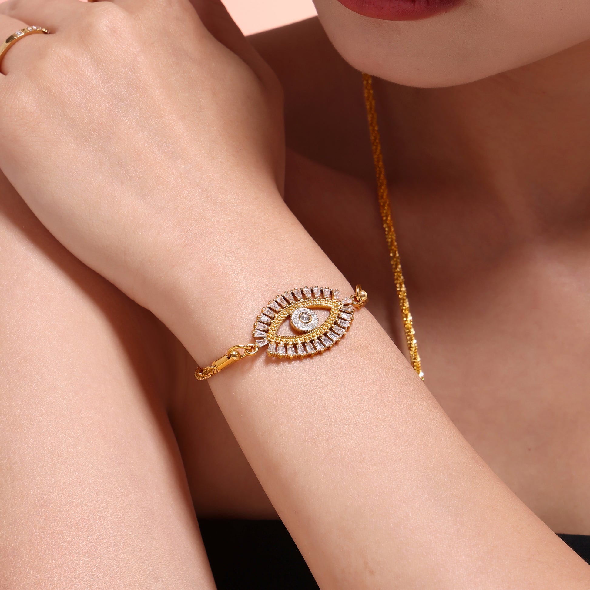 Model pairing Mystic Evil Eye Zircon Bracelet with layered stainless steel necklaces – elegant waterproof set