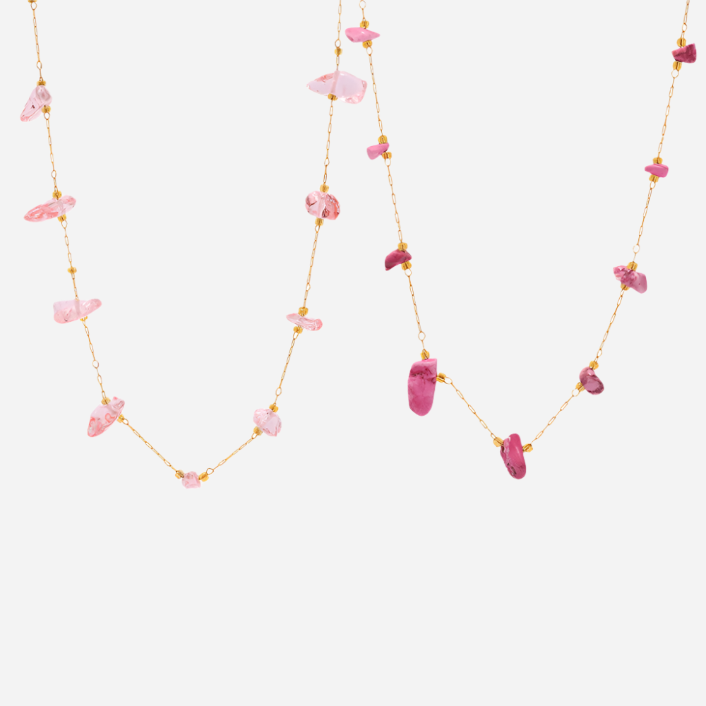 Pink and rose natural stone tennis necklaces on white background