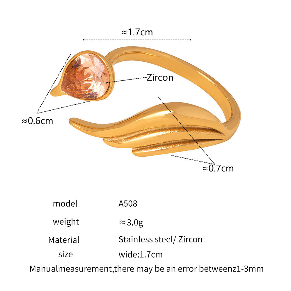 Gold ring with zircon measurement details on a white background