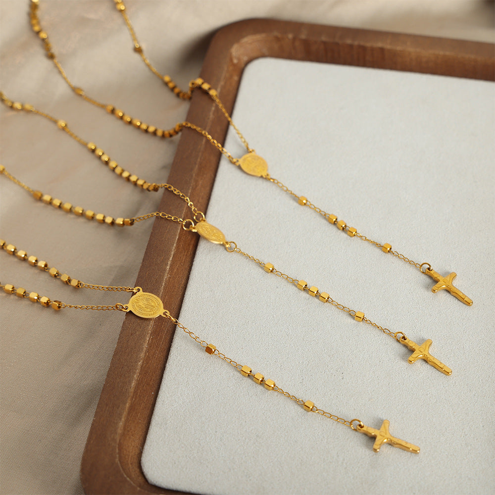 Gold Cross Pendant Necklace Pair – Displayed on Rustic Wood Surface