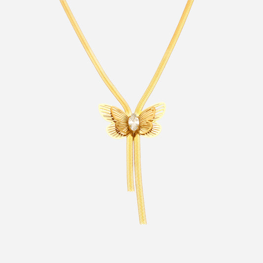 Gold butterfly necklace with a pearl center on a white background