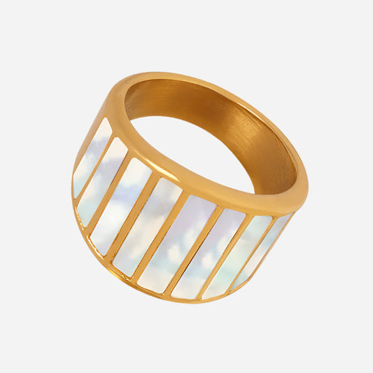 Adjustable gold ring with white stone on light gray background – minimalist jewelry

