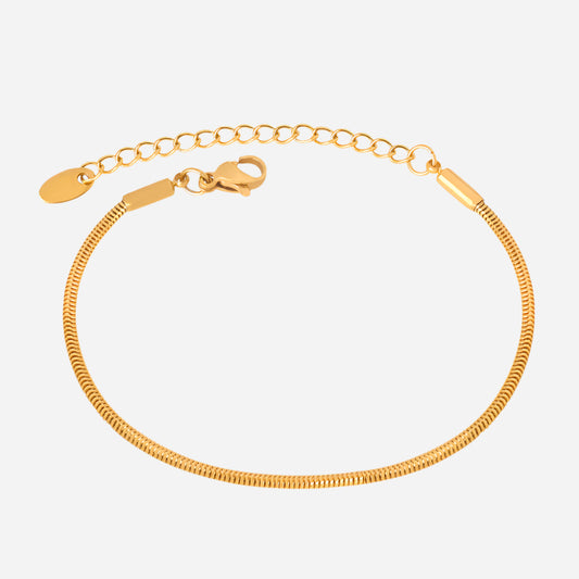 Gold bracelet on a white background