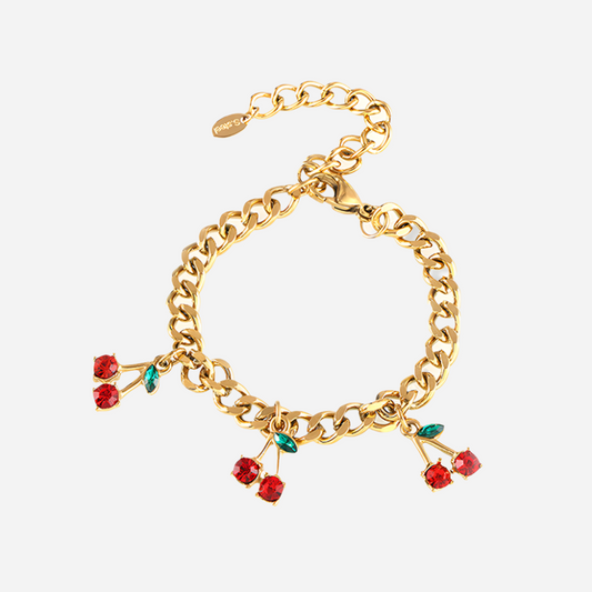 Gold chain bracelet with cherry charms on a white background