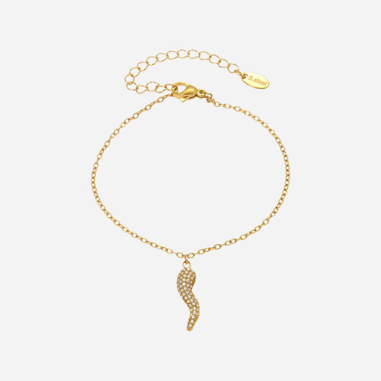 Gold bracelet with a wavy pendant on a white background