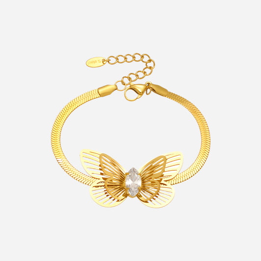 Gold bracelet with butterfly design on a white background