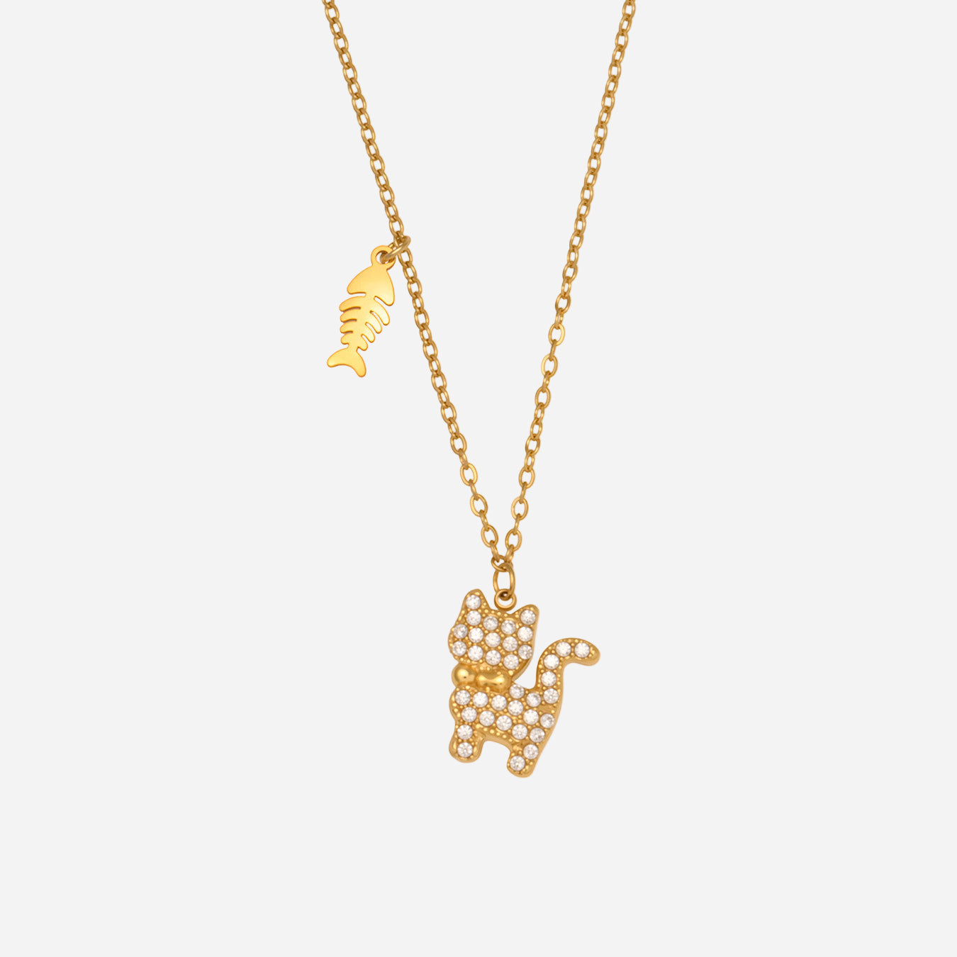 Gold CZ cat necklace with a sparkling cat pendant and mini fishbone charm on a delicate stainless steel chain.