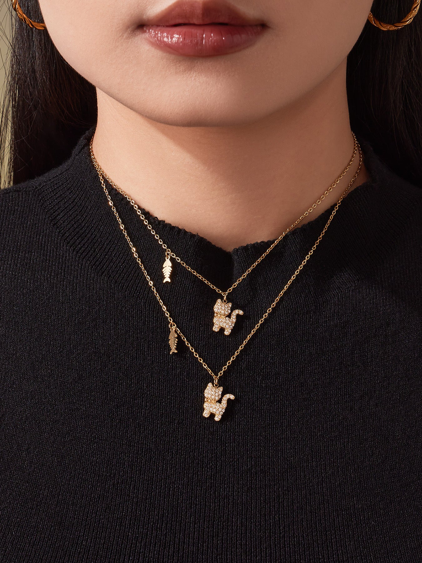 Front view of the cat pendant necklace on a model, highlighting the sparkle of the full CZ cat charm.