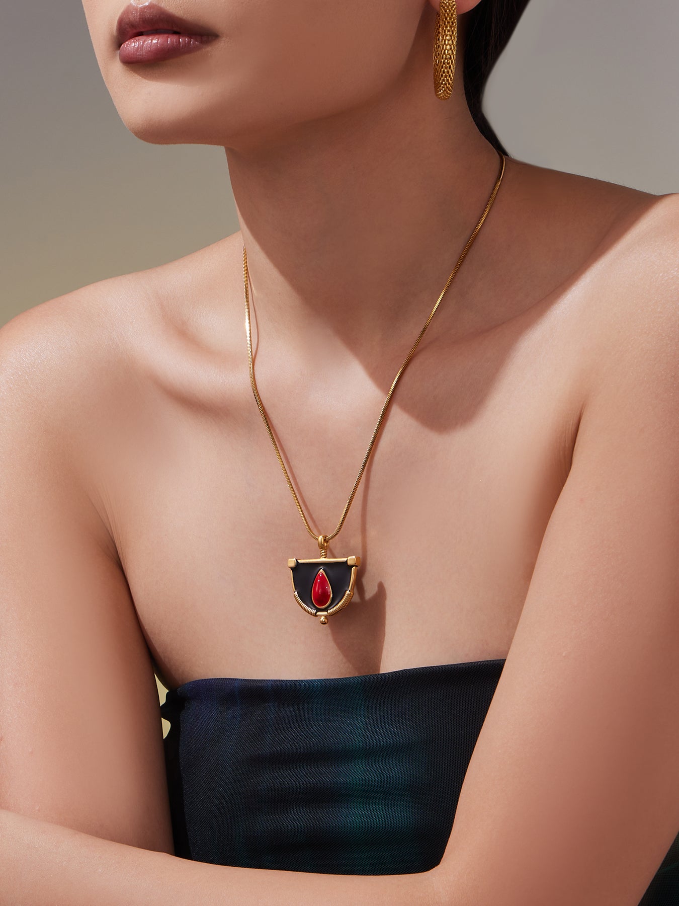 Gold Necklace with Black and Red Pendant