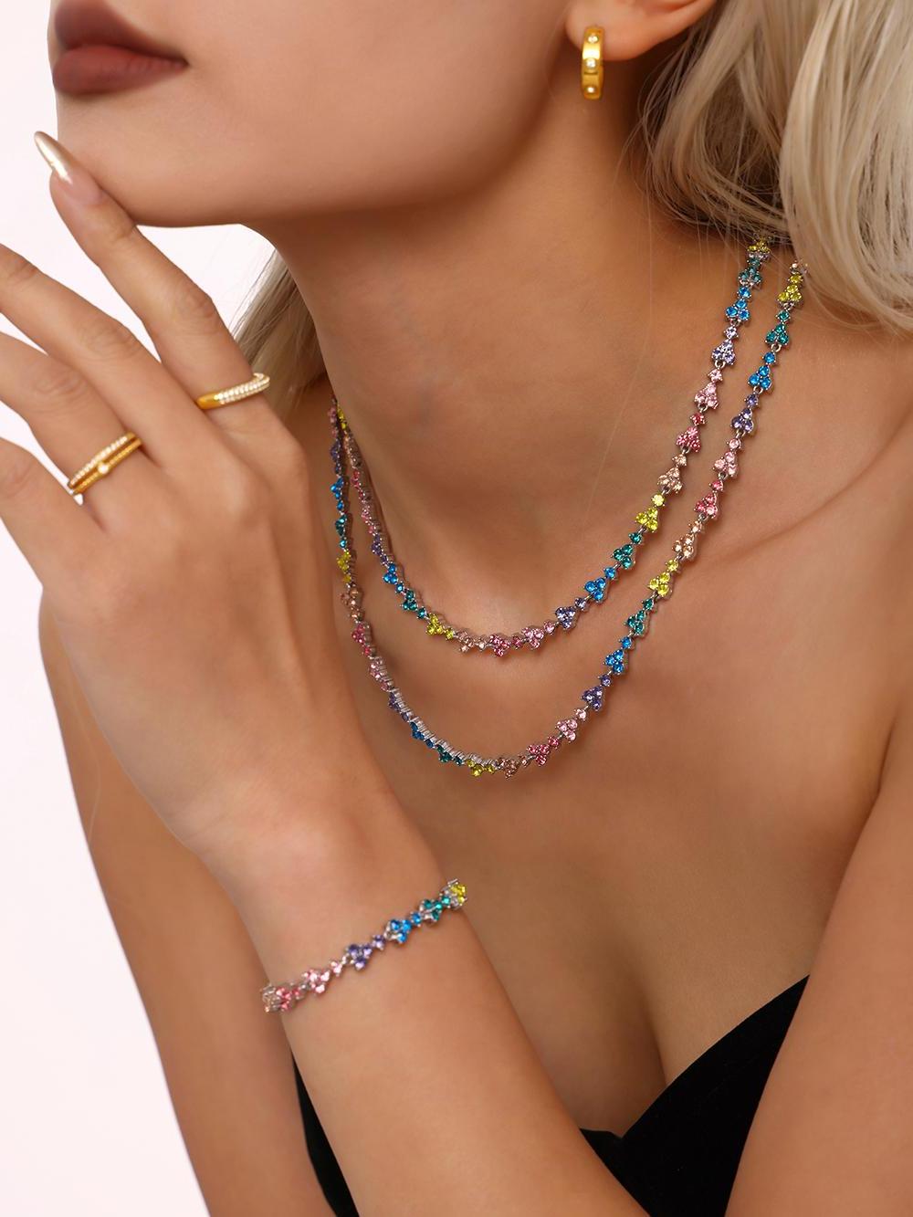 Close-up of Prism Verse tennis bracelet showing multicolor stainless steel finish