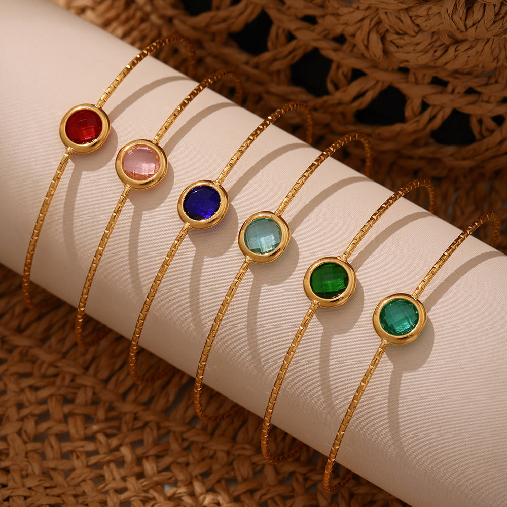 Sparkling round Czech sea glass stone on gold stainless bangle