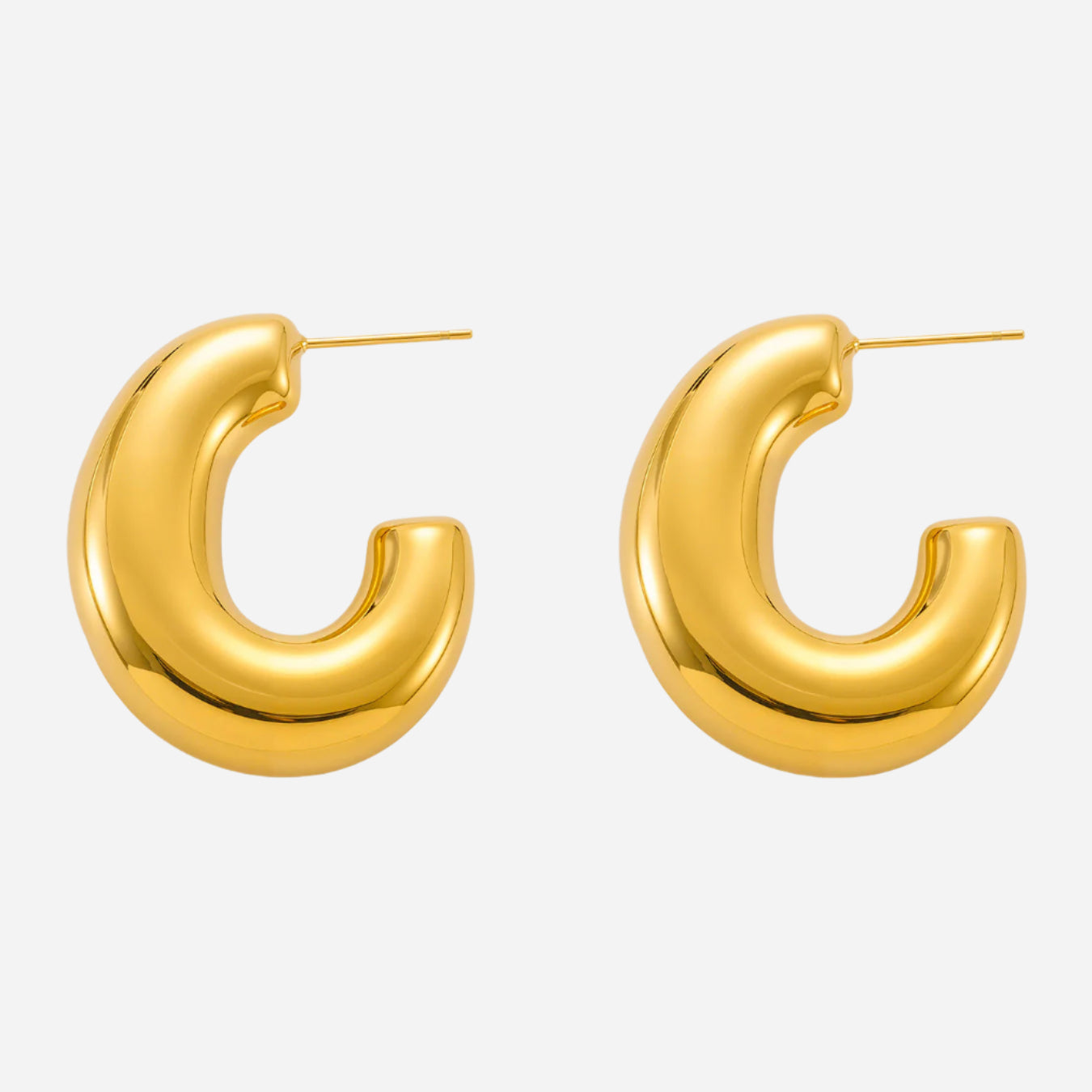Gold hoop earrings on a white background
